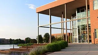 Exterior view of the BTS building adjacent to the Cedar Lake.